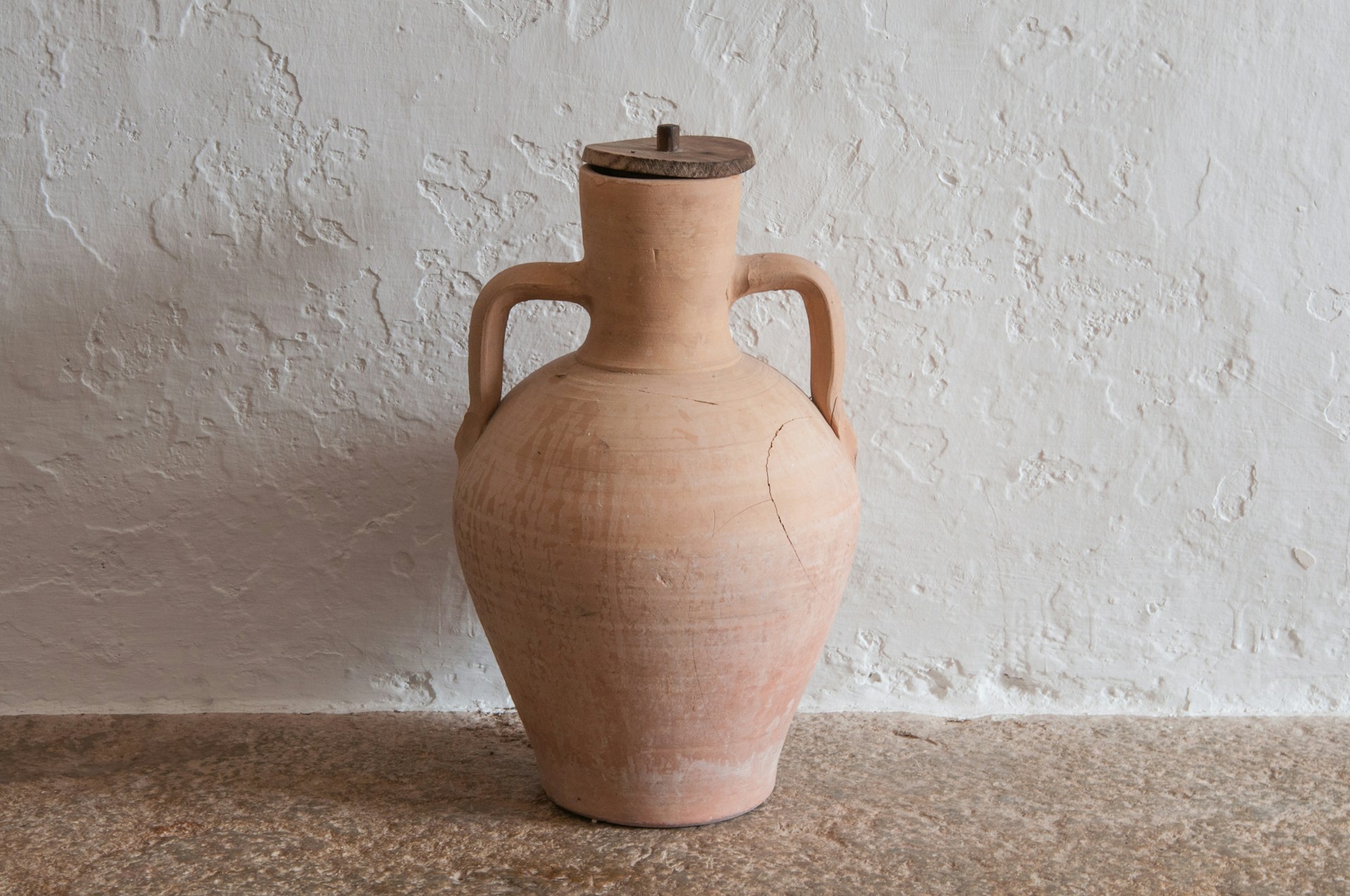 Explore how clay storage and other early methods allowed humans to store food and materials safely.