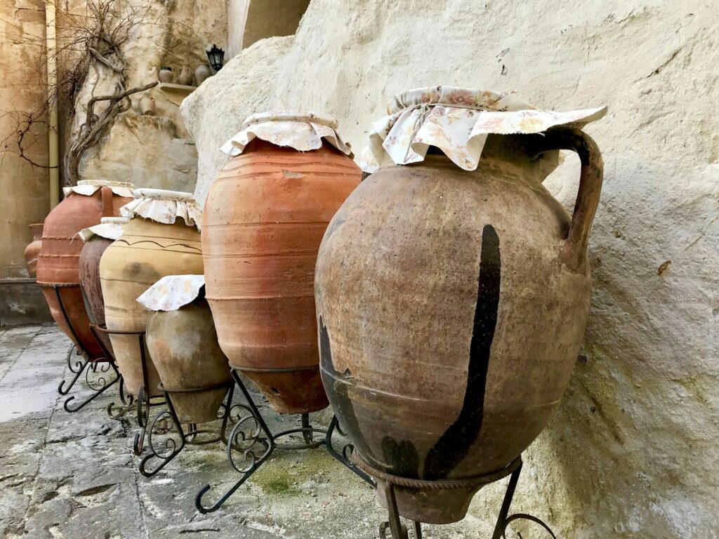 Explore how clay storage and other early methods allowed humans to store food and materials safely.