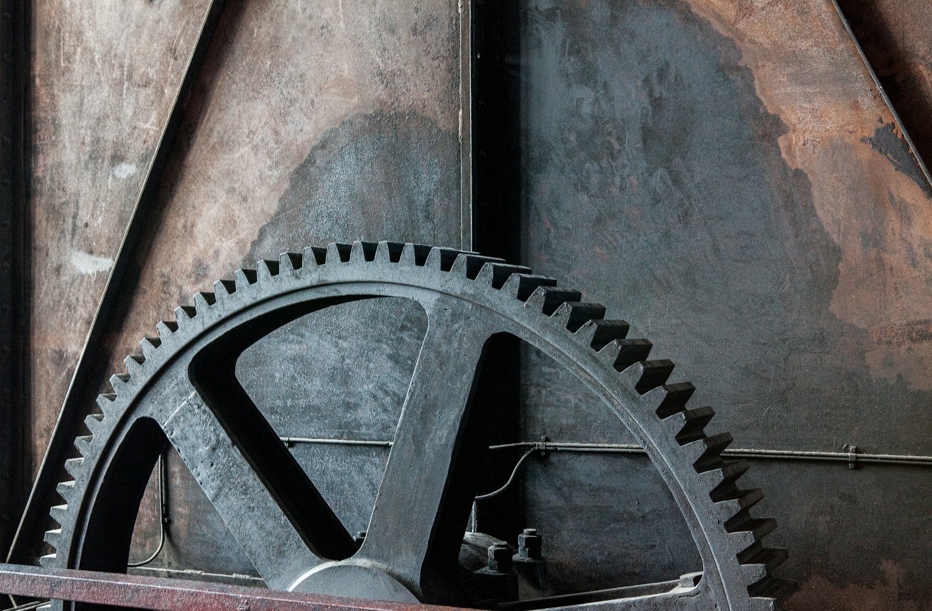 Explore the invention of gears and their role in the development of early mechanical systems